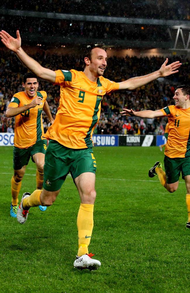 Josh Kennedy celebrates a goal for the Socceroos.