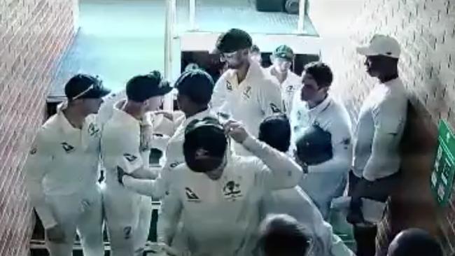 David Warner is restrained by captain Steve Smith.