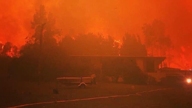 Liza Butler's home at Bawley Point as fire rushes towards it.