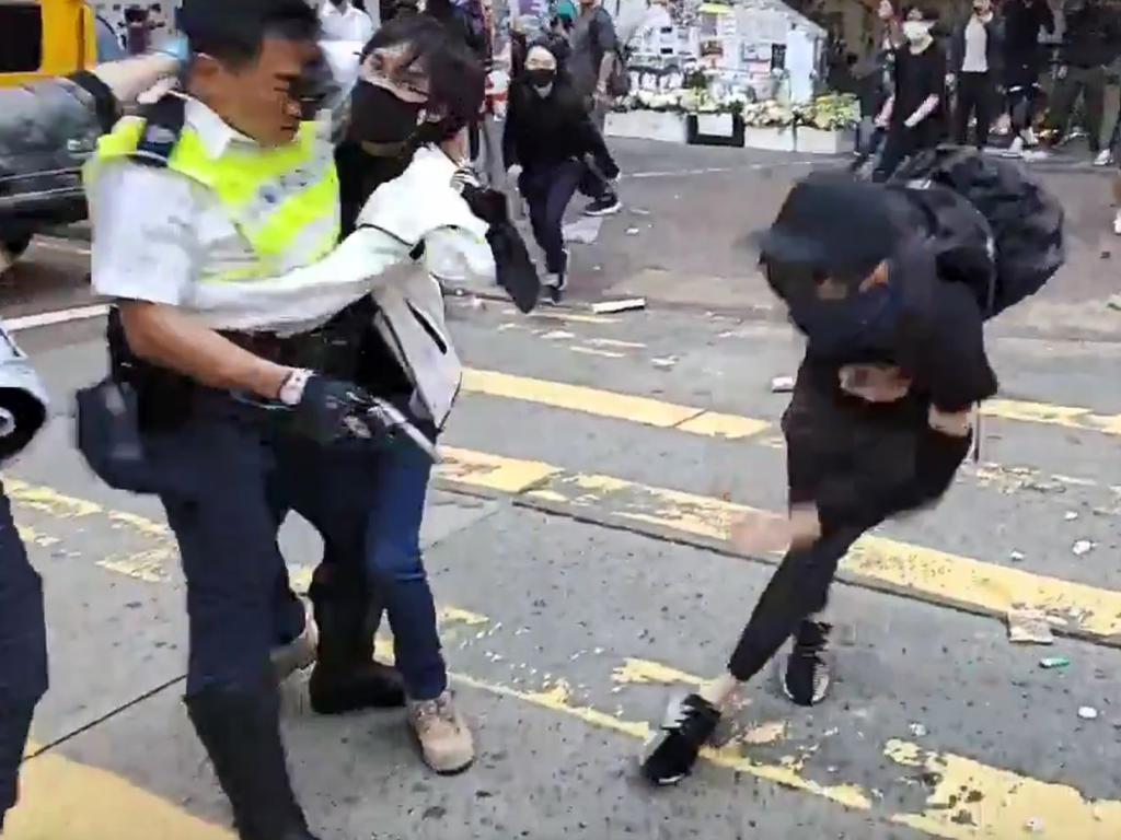 The Hong Kong police officer shot at masked protesters — hitting at least one in the torso — during clashes broadcast live on Facebook. Picture: AFP Photo/Cupid News