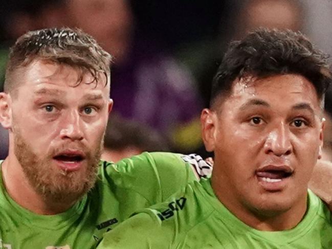 Josh Papalii of the Raiders is congratulated by his teammates after scoring the match winning try as Cameron Smith of the Storm looks on during the Round 22 NRL match between the Melbourne Storm and the Canberra Raiders at AAMI Park in Melbourne, Saturday, August 17, 2019.  (AAP Image/Scott Barbour) NO ARCHIVING, EDITORIAL USE ONLY