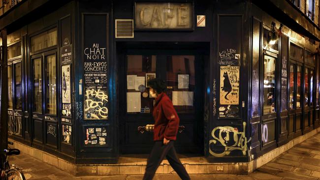 A man walks past the famous Paris bar Au Chat Noir, which is closed under measures to curb the spread of the COVID-19 in the French capital. Picture: AFP