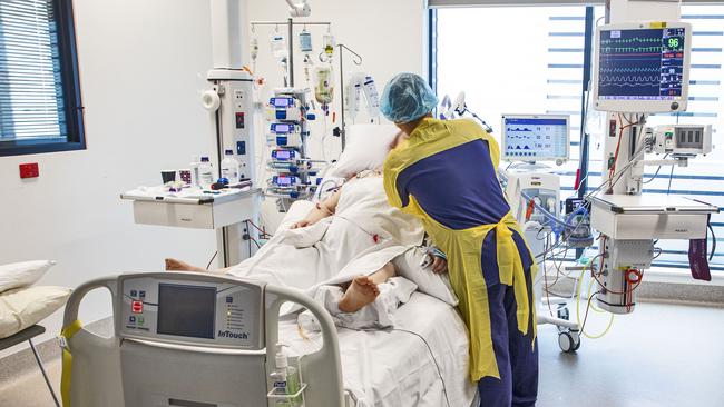 Nurse attends to a Covid-19 patient in the ICU-C ward. Picture Chris Pavlich