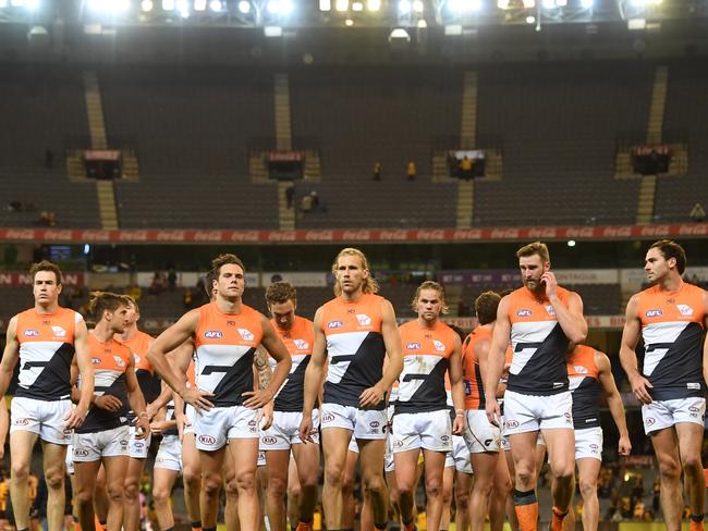 The Giants players leave the field after the Round 8 AFL match between the Hawthorn Hawks and the GWS Giants at the MCG in Melbourne, Sunday, May 12, 2019.  (AAP Image/Julian Smith) NO ARCHIVING, EDITORIAL USE ONLY