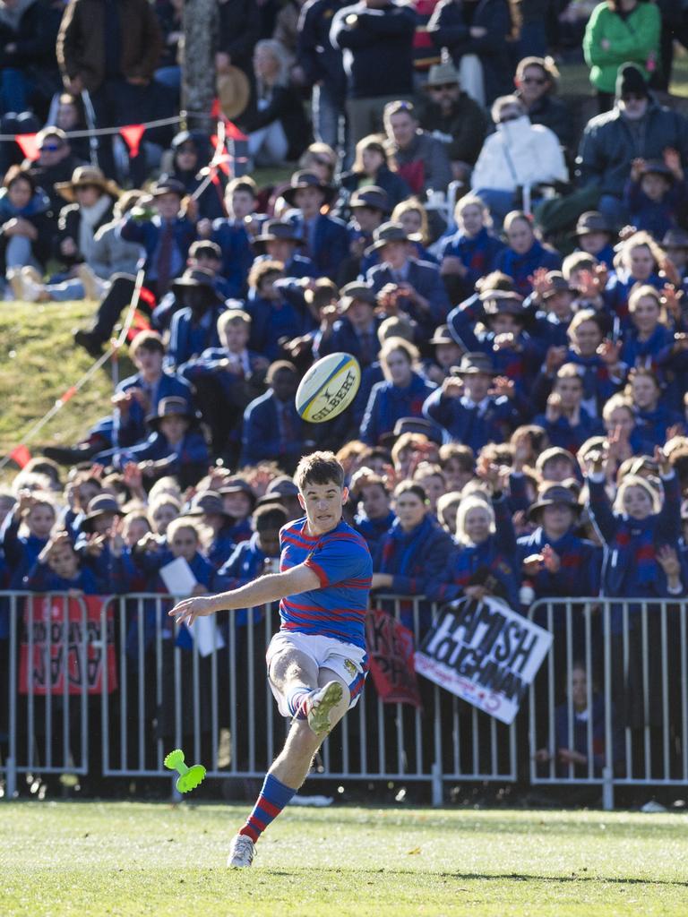 Braith Clark kicks in front of the Downlands student supporters.