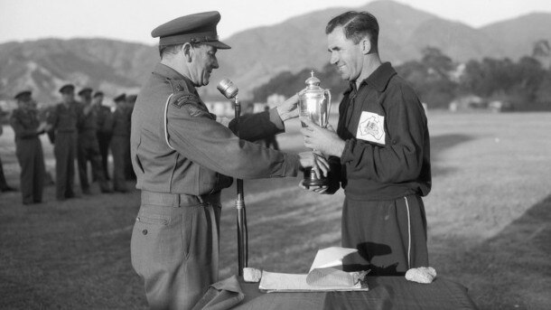 Captain Clive Smeal receiving the trophy in Hiroshima, Japan in 1952. Picture: Australian War Memorial