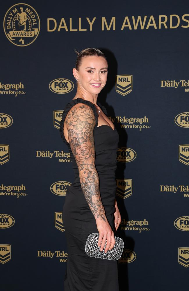 Julia Robinson of the Broncos shows off her arm ink in a ribbed black dress (Photo by Mark Kolbe/Getty Images)
