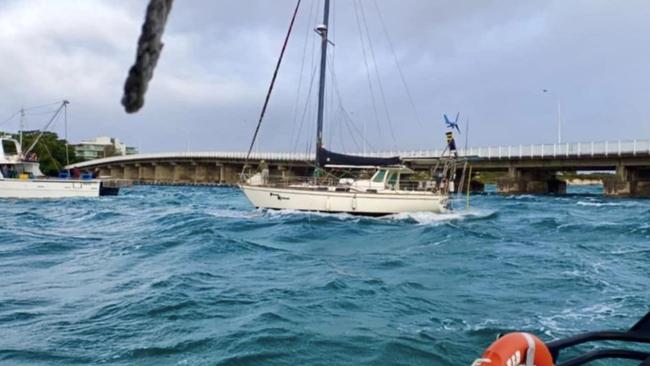 Anglers help rescue a yacht pulled from its mooring at Forster.