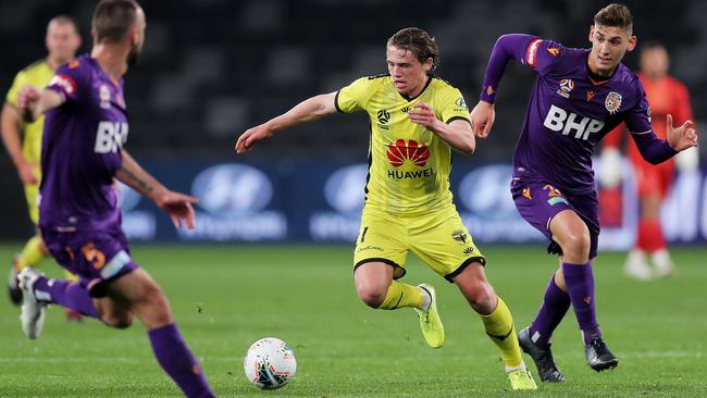 Callum McCowatt of the Phoenix is challenged by Gabriel Popovic of the Glory at Bankwest Stadium Picture: Getty Images