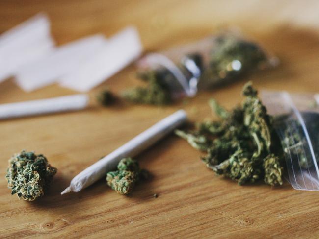Shot of dried marijuana and a rolled joint. Cannabis clipseal bag generic image. Picture: iStock