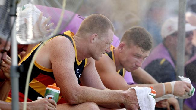 Adelaide’s Sam Jacobs and Rory Laird try to keep cool in extreme heat at Port Pirie last weekend. Picture: Sarah Reed