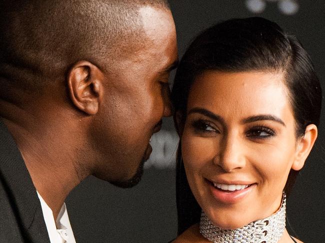 TOPSHOTS Kim Kardashian and her husband, recording artist Kanye West, arrive for the 2014 LACMA Art + Film Gala honoring film director Quentin Tarantino and artist Barbara Kruger in Los Angeles on November 1, 2014. AFP PHOTO / Valerie Macon