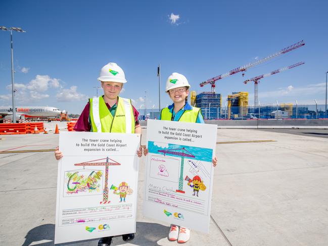 Honey Weate-Riwhi of Tweed Heads Public School and Chayse Kleinhans of St James Catholic School at Banora Point named the two new cranes,  “McCranium” and “Straighty McStrong”,  at Gold Coast Airport. Photo: Supplied