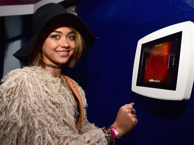 Fashionating ... atress Sarah Hyland works a hat, big furry jacket and a bunch of accessories at the H &amp; M Loves Coachella Tent. Picture: Jason Kempin/Getty Images for H &amp; M