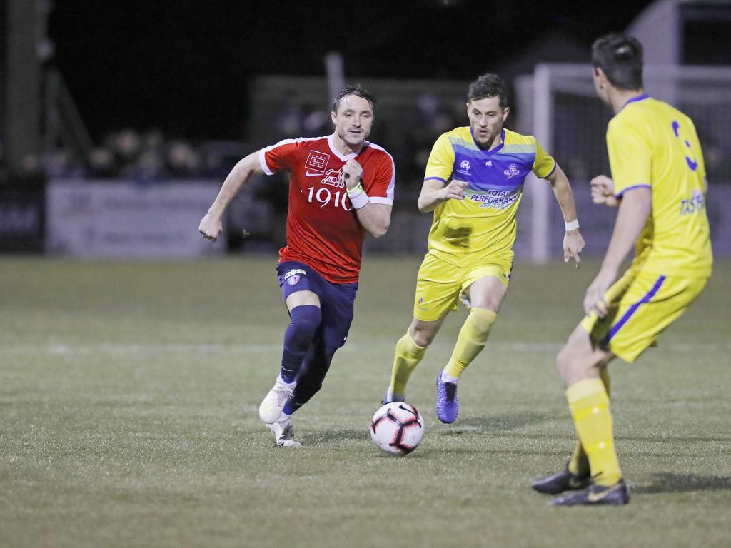 Lokoseljac Cup Final at KGV. Devonport Strikers versus South Hobart. South Hobart's Loic Feral, left, and Devonport's Joel Stone, battle for the ball. Picture: PATRICK GEE