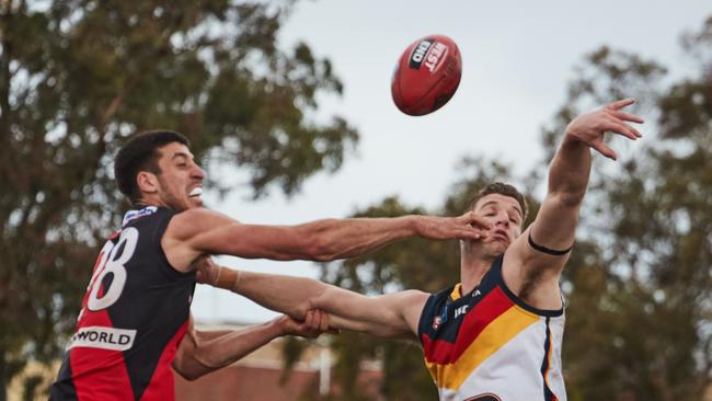 Andre Parrella and grapples with Josh Jenkins at Richmond Oval on Sunday. Picture: MATT LOXTON