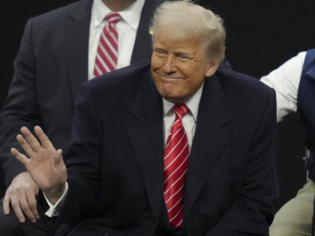 US President Donald Trump salutes the crowd during the 2025 NCAA Division I Men's Wrestling Championship at the Wells Fargo Center on March 22 in Philadelphia, Pennsylvania. Picture: Mitchell Leff/Getty Images/AFP