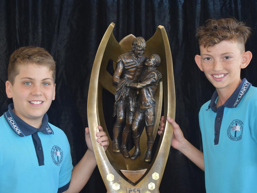 Blake Battaia (left) and Harper Shields with the NRL Provan-Summons Trophy at Mercy College, Mackay, September 16, 2021. Picture: Matthew Forrest