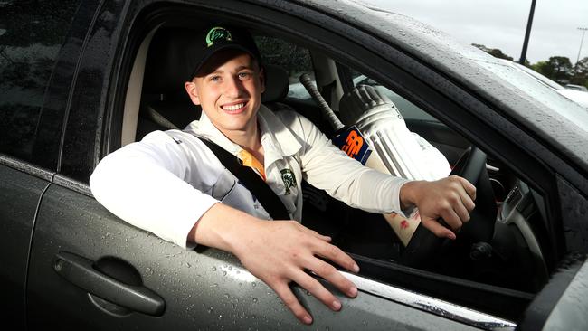 Box Hill cricketer Blake Nikolic with his car at Gordon Barnard Reserve on Saturday in Balwyn North. Picture: Hamish Blair