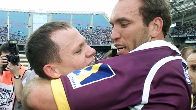 Walters and Gorden Tallis embrace after the Broncos beat the Roosters in the 2000 grand final