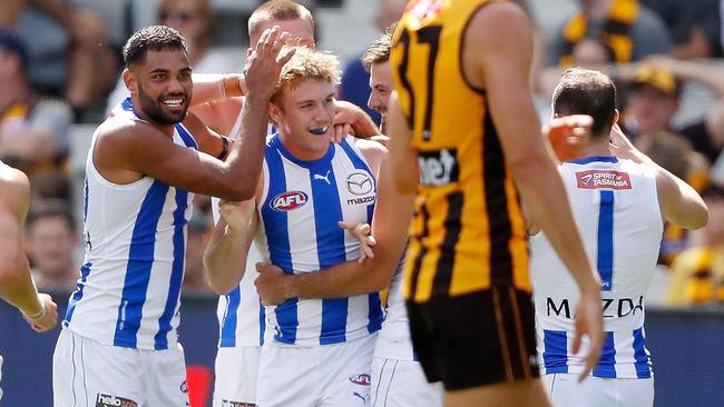 Teammates flock to Jason Horne-Francis after his first AFL goal. Picture: Dylan Burns/AFL Photos via Getty Images