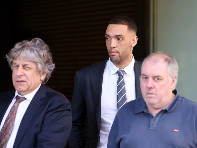 Alec Vidot-Coleman (centre) with his solicitor Brett Galloway (left) and a supporter at Downing Centre court complex on Friday. Picture: NCA NewsWire / Damian Shaw