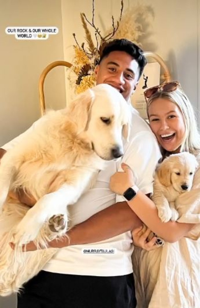 Murray Taulagi with partner Claudia Schroder and dogs Ryder and Rocky. Photo: Instagram.