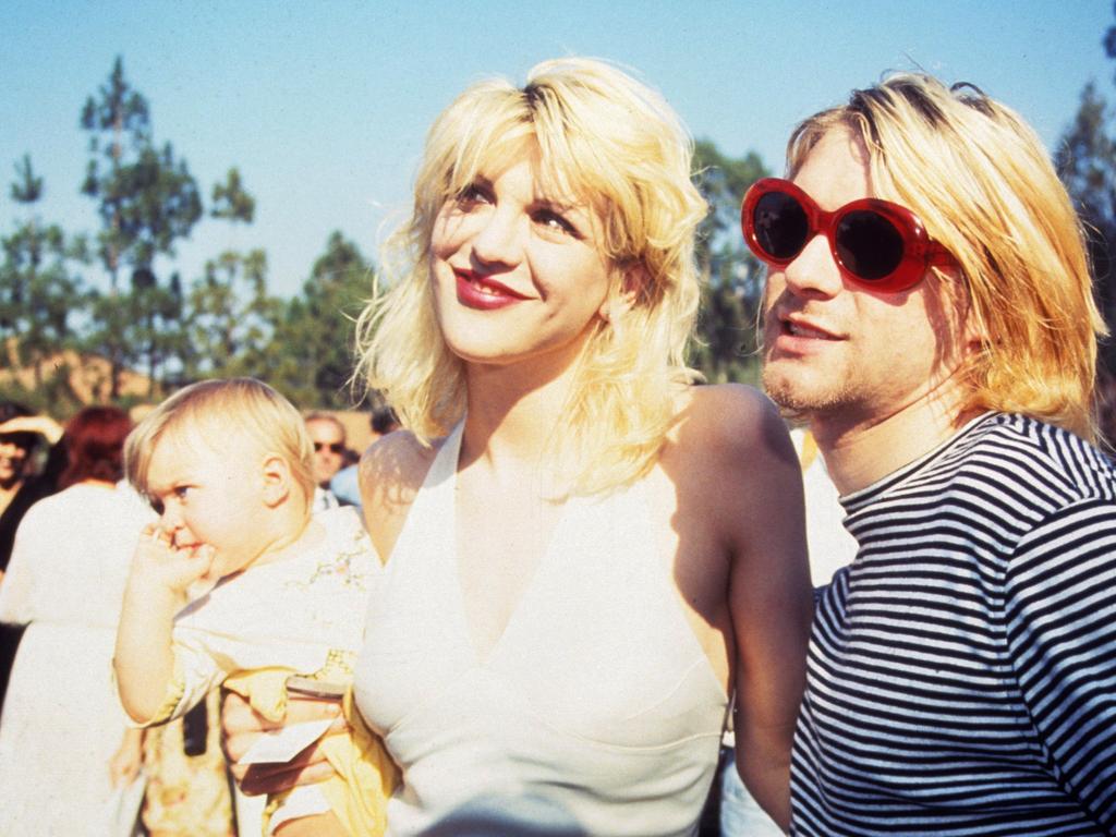 Look out, the 90s are back (including the stripes. Kurt Cobain of Nirvana (right) with wife Courtney Love and daughter Frances Bean Cobain (Photo by Terry McGinnis/WireImage)