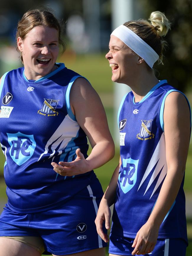 Sarah Guest and Emilie Biggar share a quarter-time joke. Picture: Chris Eastman