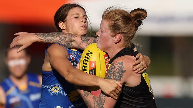 West Coast’s Belinda Smith wraps up Tayla Stahl. Picture: Paul Kane/Getty Images