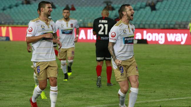 Newcastle striker Roy O'Donovan, right, celebrates a goal against Western Sydney Wanderers. Picture: Getty Images