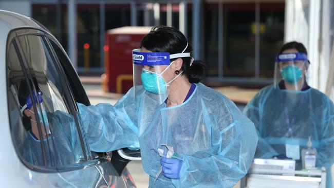 Australian Clinical Labs team members Sarah White and Caitlin Walmsley conducting COVID tests in Geelong West last year. Picture: Alan Barber