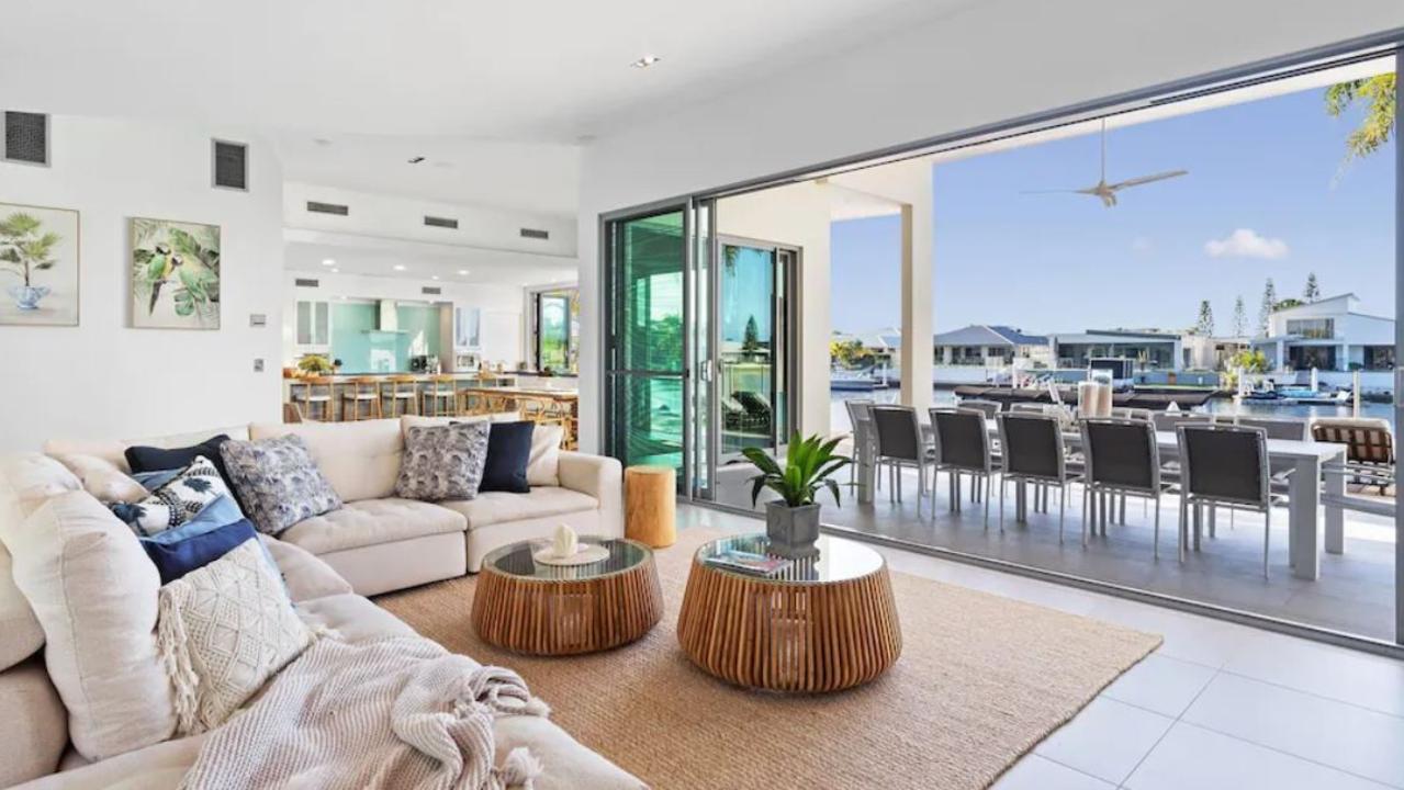 A breakfast bar facing the water features in this Pelican Waters abode.