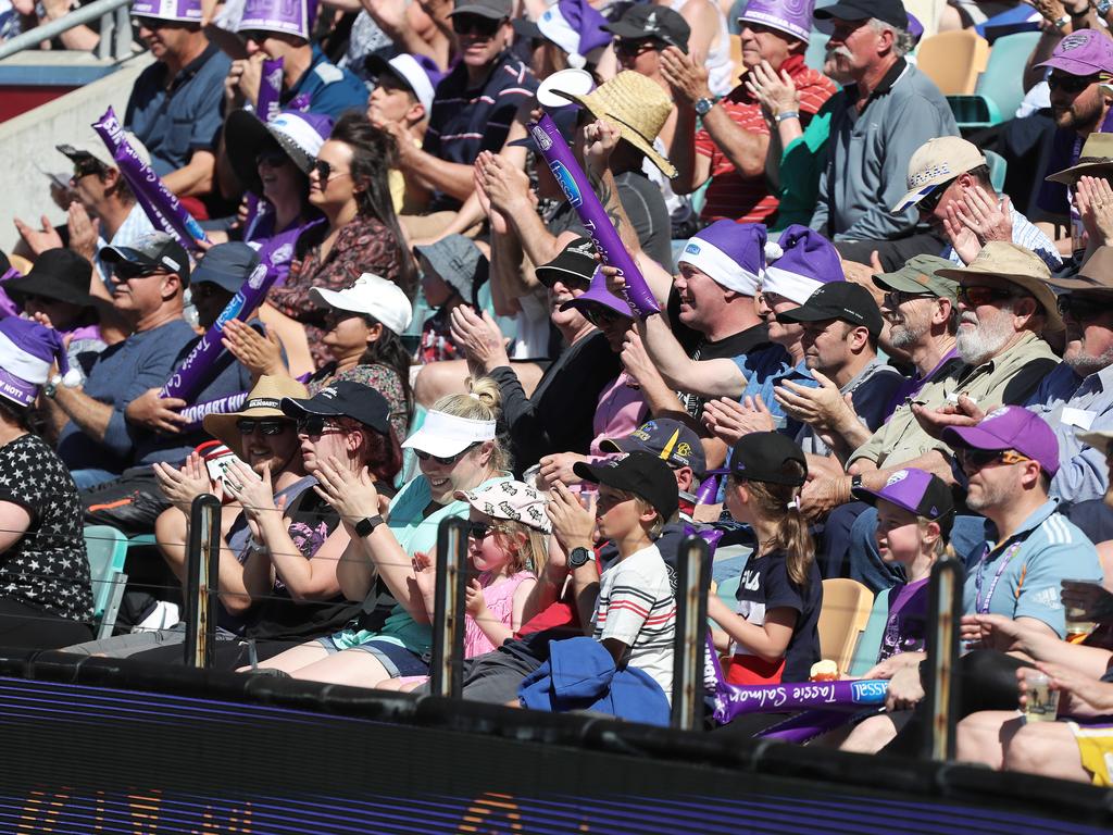 Fans enjoying the hot weather at the Big Bash match between the Hurricanes and Melbourne Stars at Blundstone Arena on Christmas Eve. Picture: LUKE BOWDEN