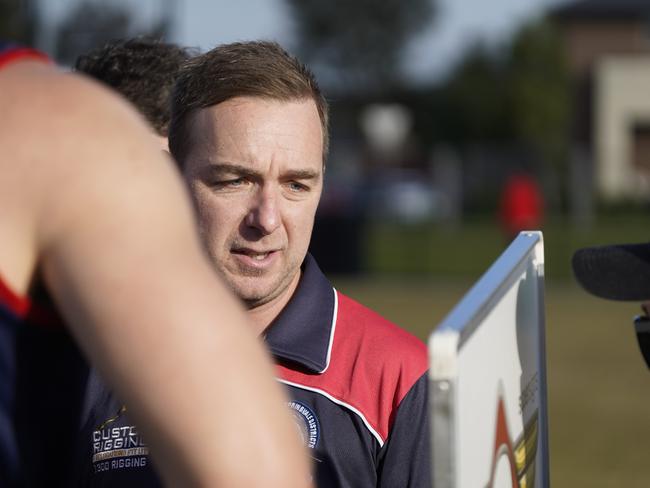 Springvale Districts coach Kris Thompson addressing his players at quarter time on Saturday. Picture: Valeriu Campan