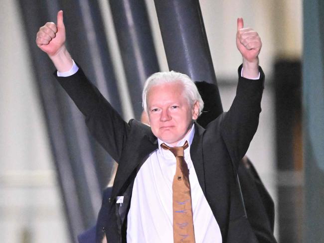 WikiLeaks founder Julian Assange gives thumbs up after arriving at Canberra Airport. Picture: William West/AFP