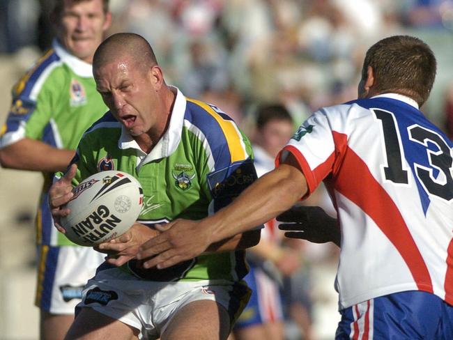 19 Mar 2005: NRL Newcastle vs Canberra in Canberra - Knights Daniel Abraham tackles Raiders Jason Smith (L). pickym/smith sport rugby league action