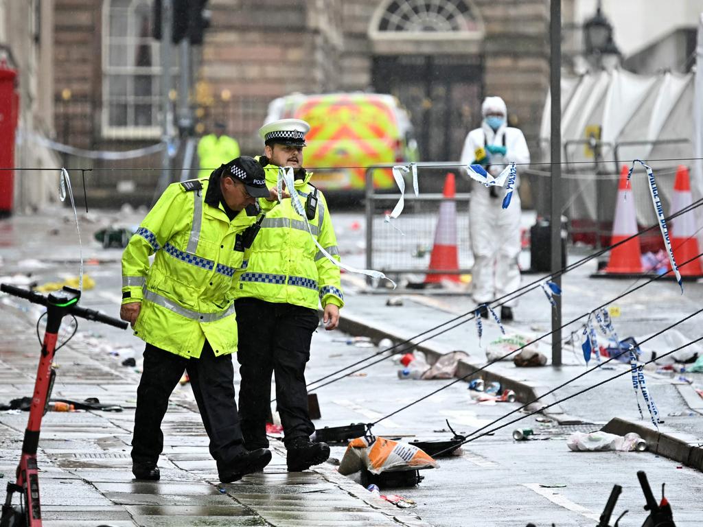 Police and forensics officers work at the scene on Water Street in Liverpool. Picture: Paul Ellis/AFP