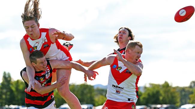 Round 9 TSL game between Clarence v Lauderdale from Richmond Oval. Lauderdale's Nicholas Connors has his mark spoiled by Clarence's Noah Holmes as Clarence's Josh Green and Lauderdale's William Poland compete for the ball. Picture: Zak Simmonds