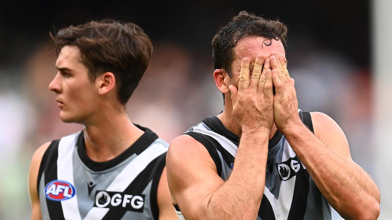 MELBOURNE, AUSTRALIA - APRIL 17: Connor Rozee and Travis Boak of the Power look dejected after losing the round five AFL match between the Carlton Blues and the Port Adelaide Power at Melbourne Cricket Ground on April 17, 2022 in Melbourne, Australia. (Photo by Quinn Rooney/Getty Images)