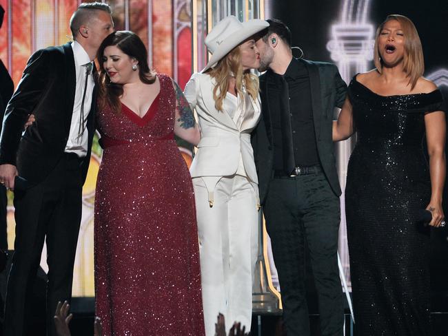 Musicians Macklemore, Mary Lambert, Madonna, Ryan Lewis and Queen Latifah perform onstage during the 56th Grammy Awards, 2014. Picture: Kevin Winter