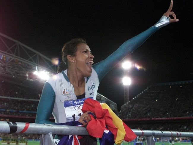 Cathy Freeman celebrates her famous 400m win at the 2000 Sydney Olympic Games. Picture: Craig Borrow.