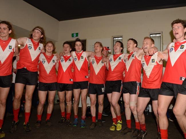 MPNFL Division 2 second semi-final: Red Hill v Langwarrin at Chelsea. Red Hill players belt out the club song. Picture: AAP/ Chris Eastman