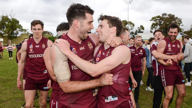 Ruckman Cameron Giles and playing coach Craig Pitt celebrate after winning the Adelaide Footy League division one grand final for Prince Alfred Old Collegians. Picture: Brenton Edwards