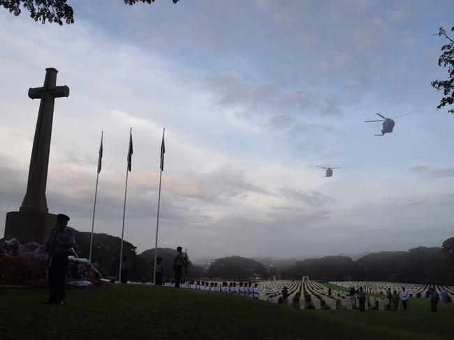 RAAF choppers fly over Bomana War Cemetery at the dawn service. Picture: Justin Lees