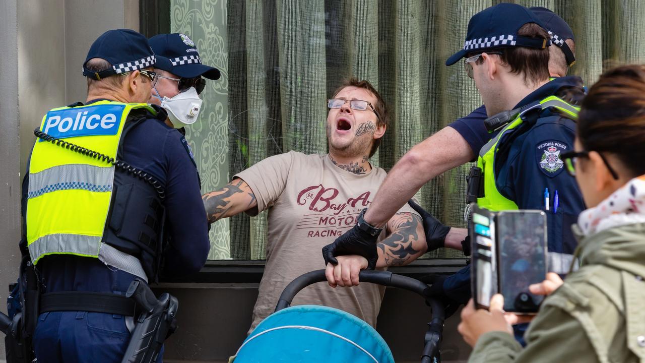 The dad is separated from two infants as he protests outside Parliament. Picture: Speed Media/Shutterstock