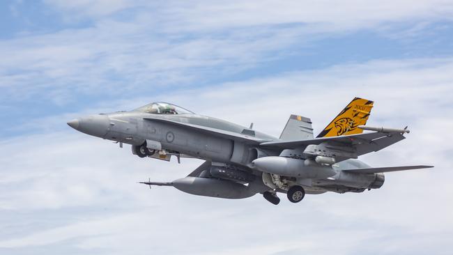 A RAAF F/A-18A Hornet from No. 2 Operational Conversion Unit, launches for a sortie out of RAAF Base Darwin during Exercise Diamond Storm.