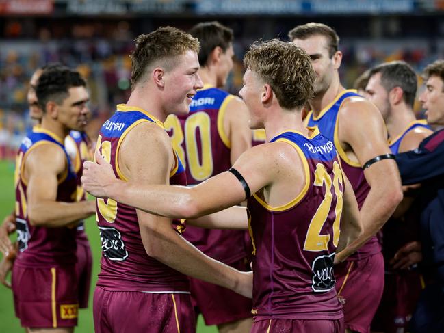 Morris with Jaspa Fletcher after the QClash win. Picture: Russell Freeman/AFL Photos