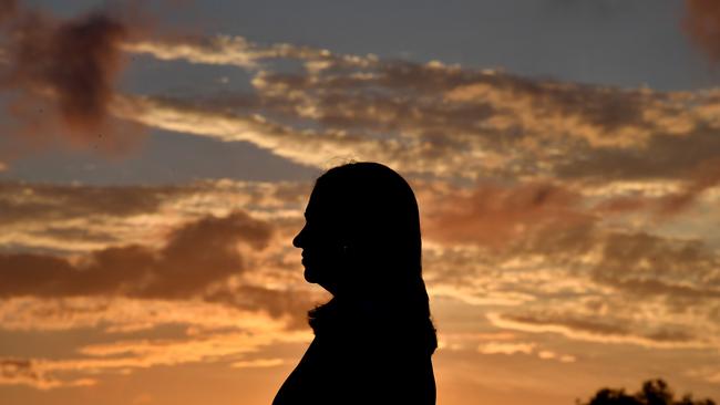 Queensland Premier Annastacia Palaszczuk being interviewed at sunset on the shores of Pioneer Bay on the first day of the Queensland Election campaign in Airlie Beach. (AAP Image/Darren England)