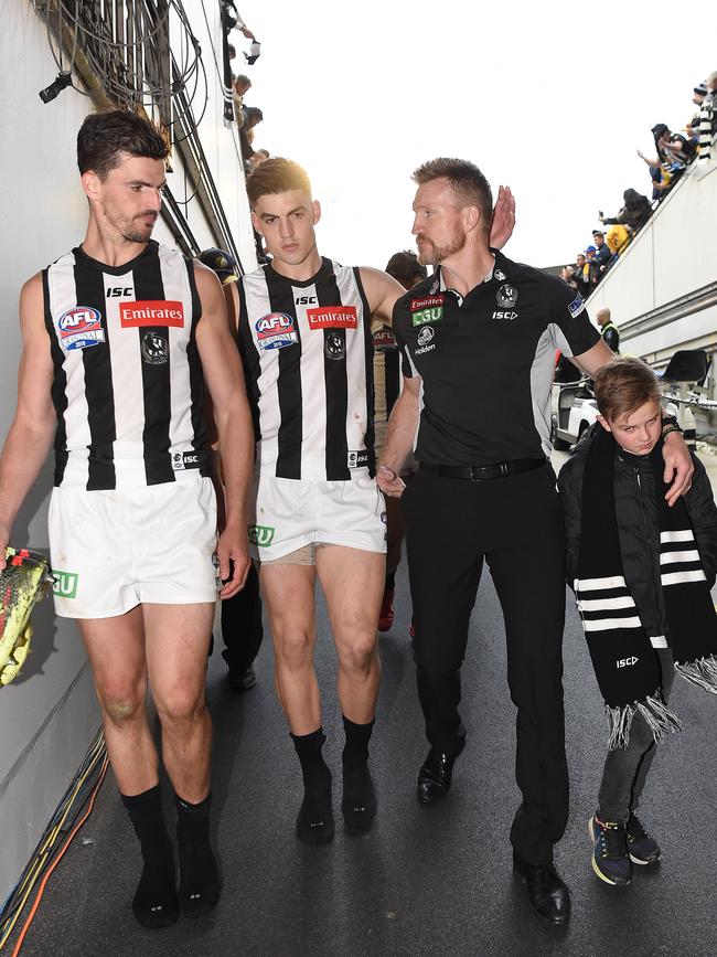 A shattered Maynard with Scott Pendlebury and Nathan Buckley after last year’s Grand Final loss. Picture: Nicole Garmston